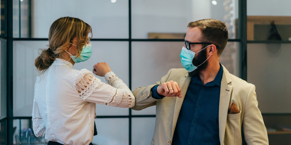 Business people greeting during COVID-19 pandemic
