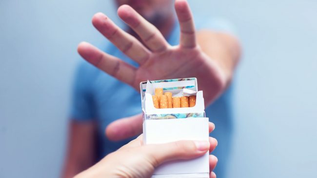 bigstock-man-refusing-a-cigarette-from-242727175