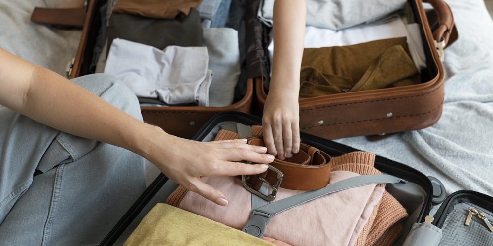mother-and-son-preparing-suitcase-for-their-holiday